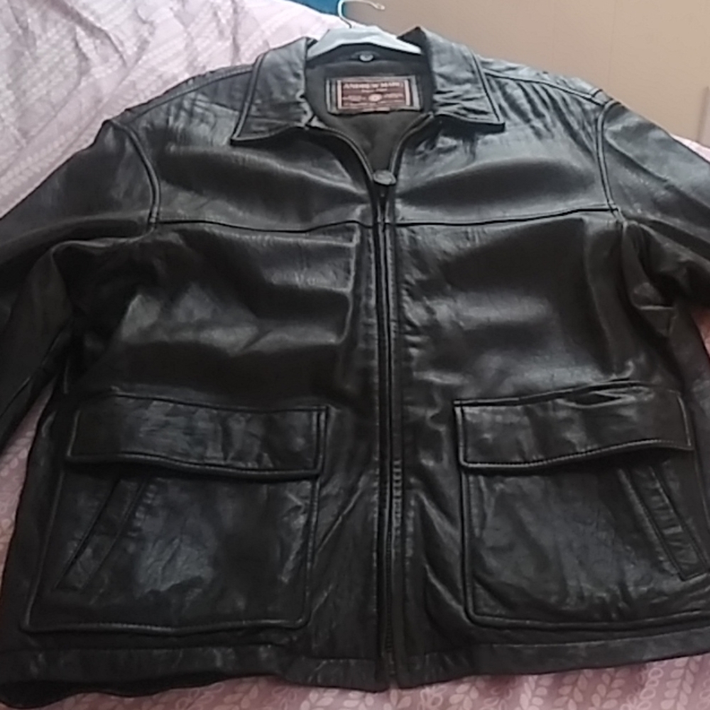 Buttery soft Andrew Marc black leather coat.